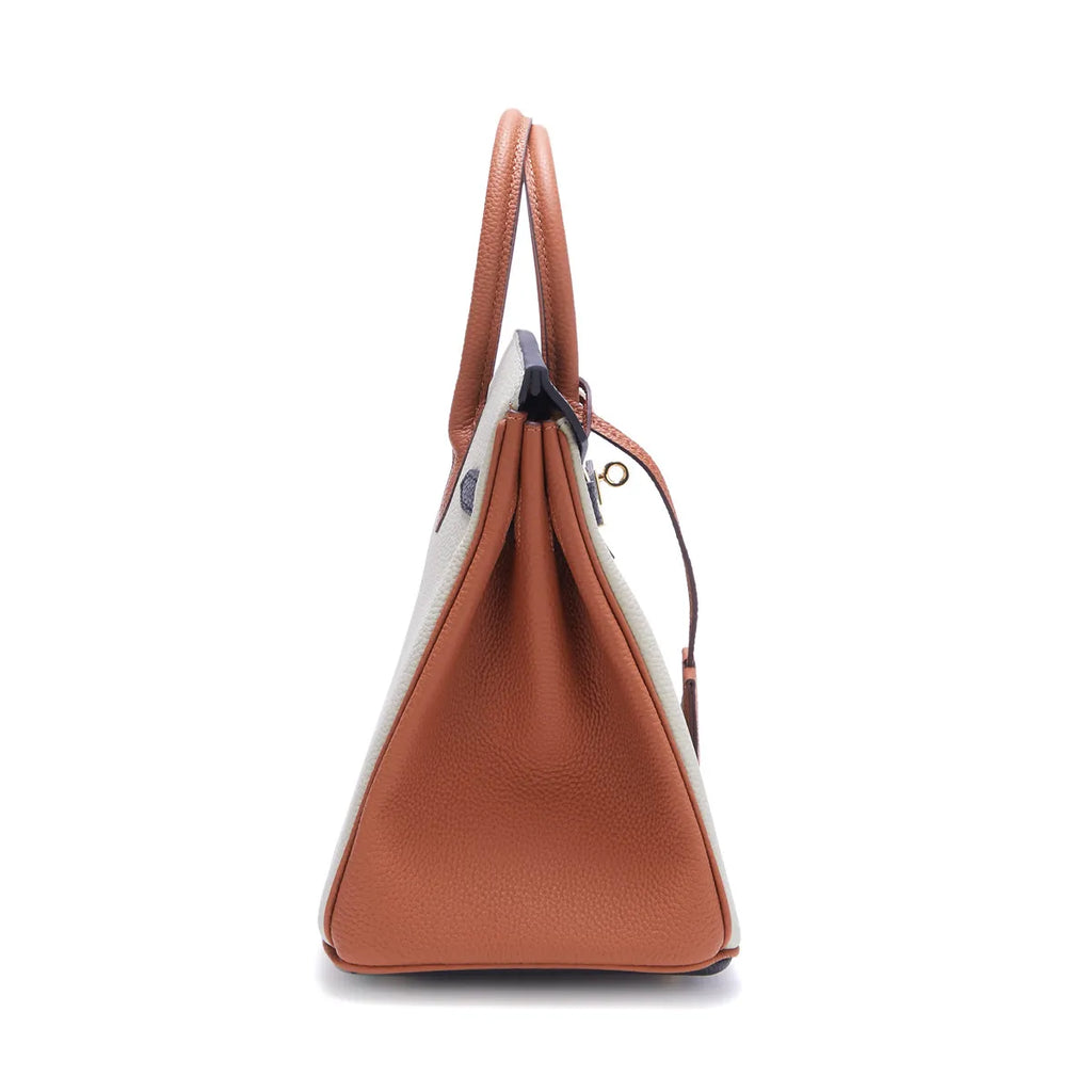 Stylish two-tone handbag made of genuine Togo leather. 14