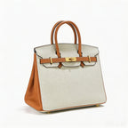 Stylish two-tone handbag made of genuine Togo leather. 17