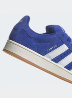 Adidas Campus 00s Semi Lucid Blue Elegant sneakers showcasing blue suede and Cloud White accents. 11