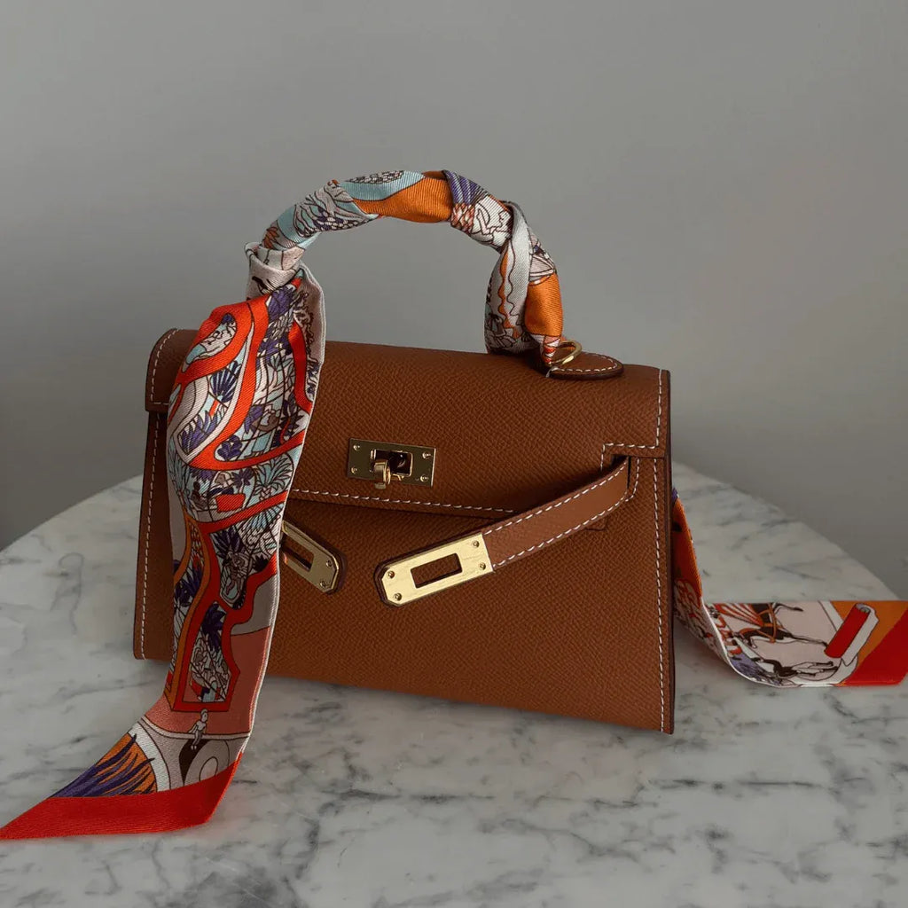 Chic Epsom leather handbag in various colors. 16