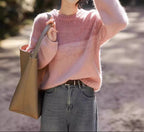 Ladies shiny chunky knit sweater with high collar in pink and brown.
