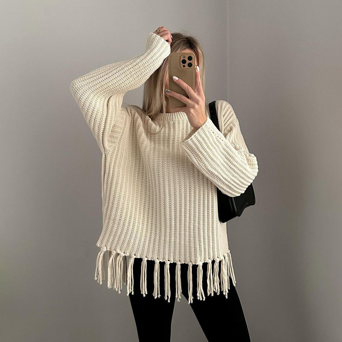 Ladies knitted sweater with fringe, perfect for stylish comfort. 8