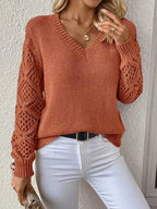 Elegant long sleeve V-neck sweater for women in various colors.
