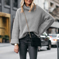 Elegant ladies sweater with high collar in various colors.