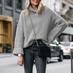 Elegant ladies sweater with high collar in various colors.