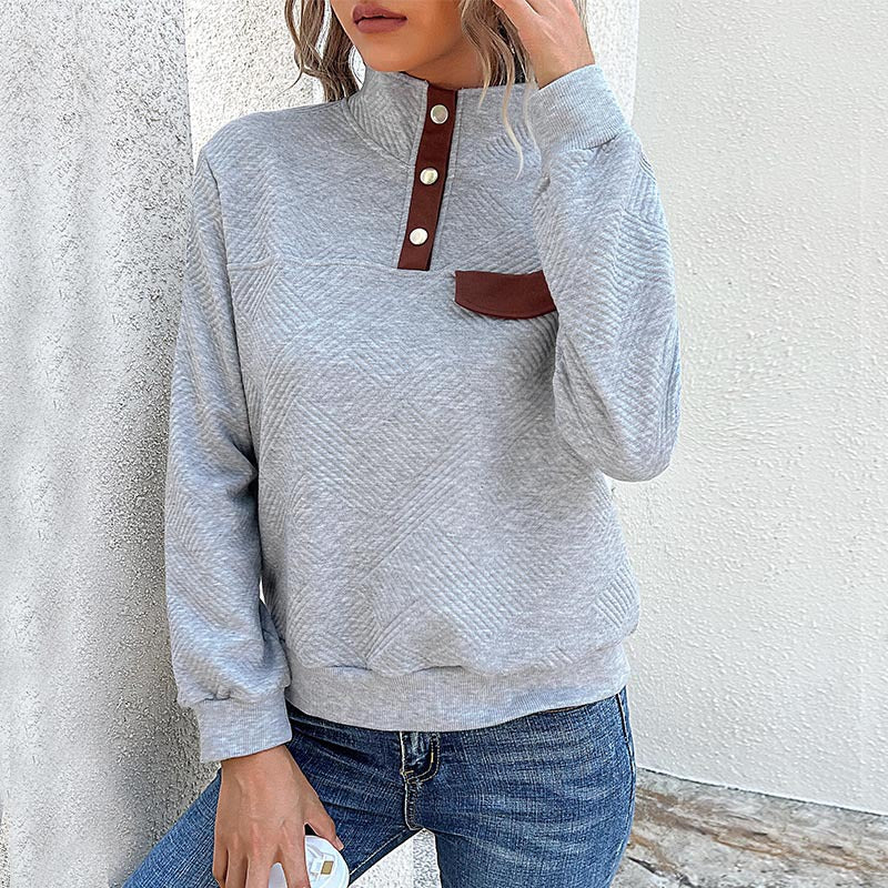 Elegant ladies turtleneck sweater with button details in blue.