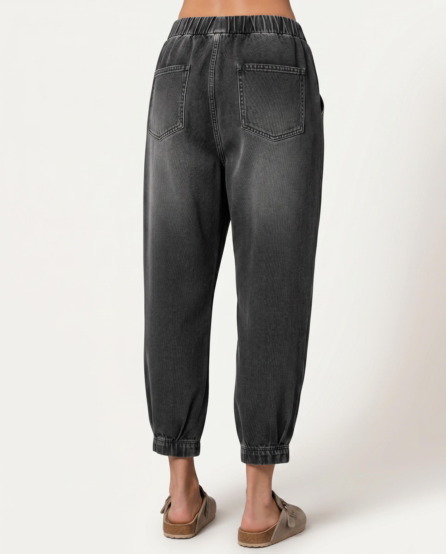 Patsy tapered jeans in black with elastic waistband for women. 2