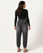 Patsy tapered jeans in black with elastic waistband for women. 5