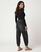 Patsy tapered jeans in black with elastic waistband for women. 6