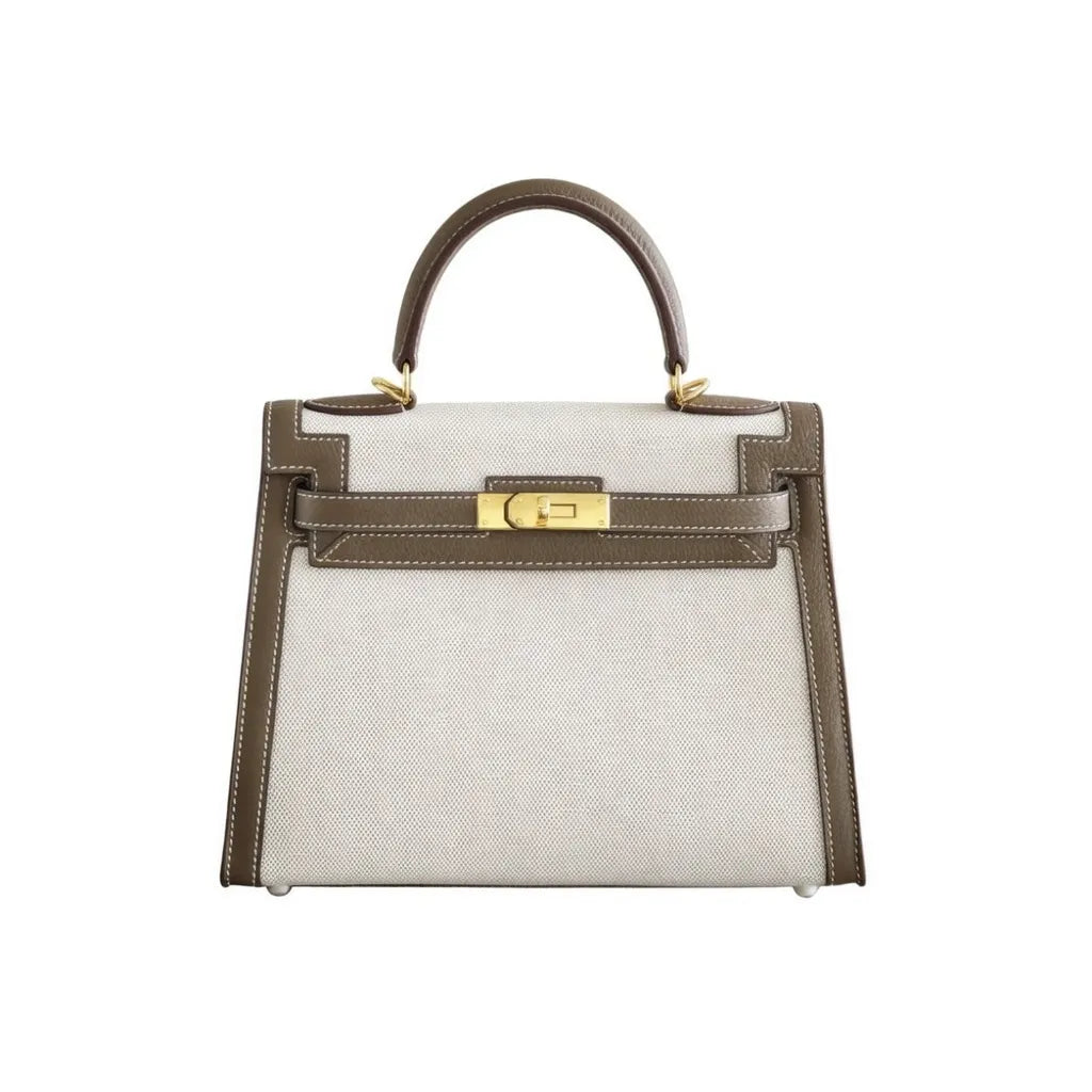 Sola Elegant Handbag with two-tone design and gold-tone hardware.
