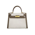 Sola Elegant Handbag with two-tone design and gold-tone hardware.