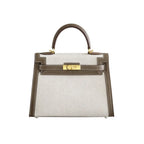 Sola Elegant Handbag with two-tone design and gold-tone hardware.