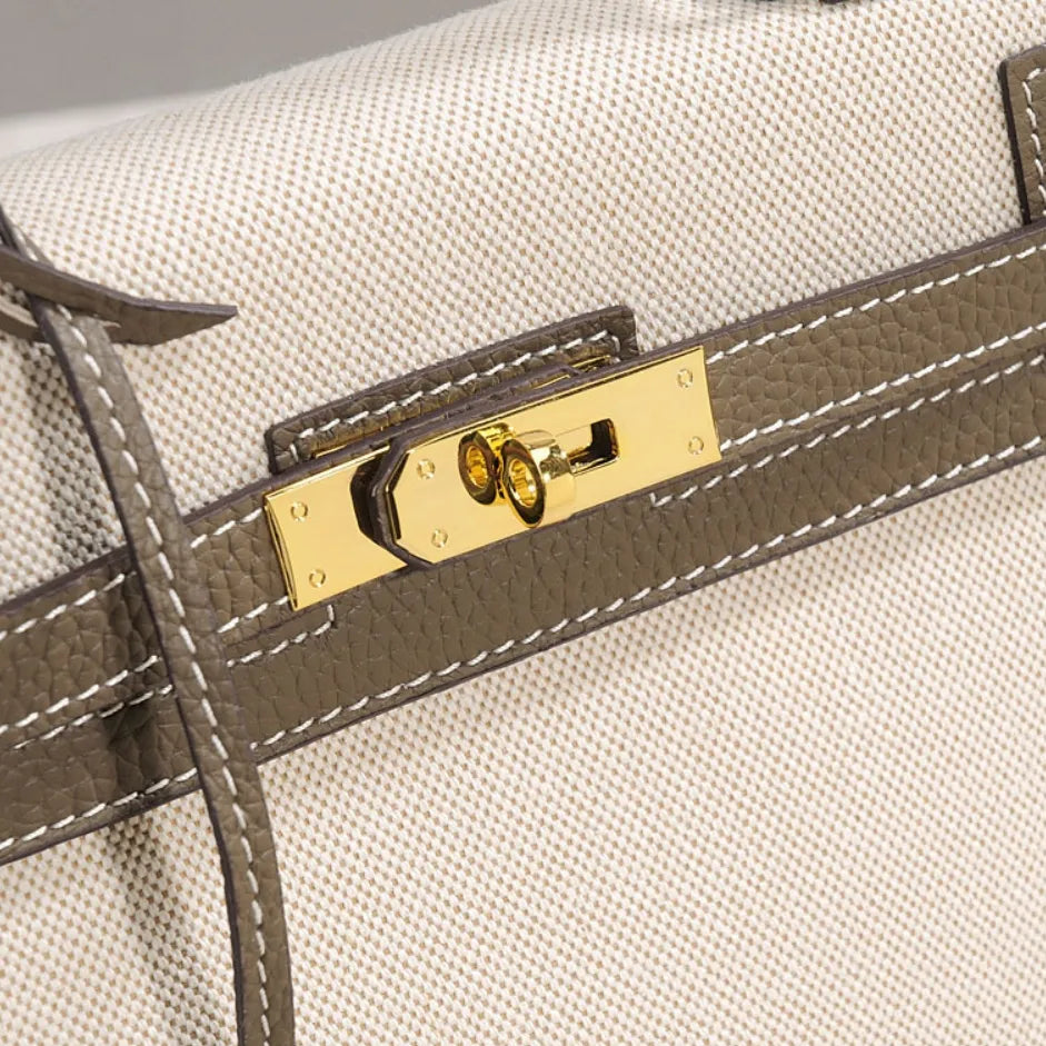 Sola Elegant Handbag with two-tone design and gold-tone hardware. 10