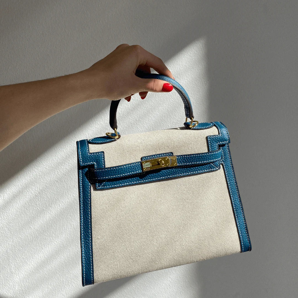 Sola Elegant Handbag with two-tone design and gold-tone hardware. 11