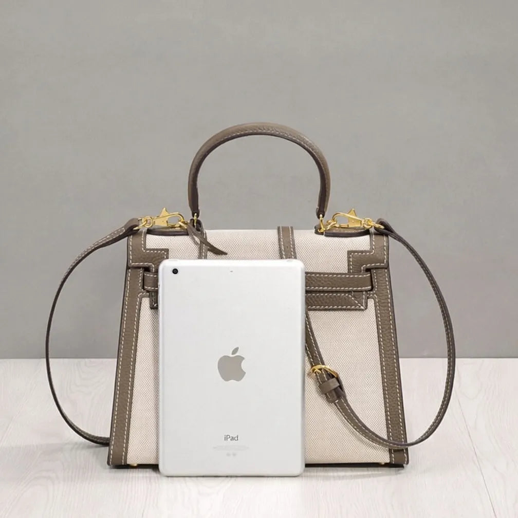 Sola Elegant Handbag with two-tone design and gold-tone hardware. 12