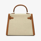 Sola Elegant Handbag with two-tone design and gold-tone hardware. 16