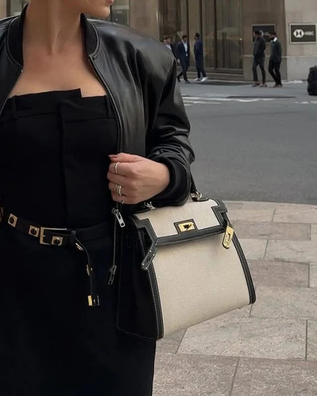 Sola Elegant Handbag with two-tone design and gold-tone hardware. 2