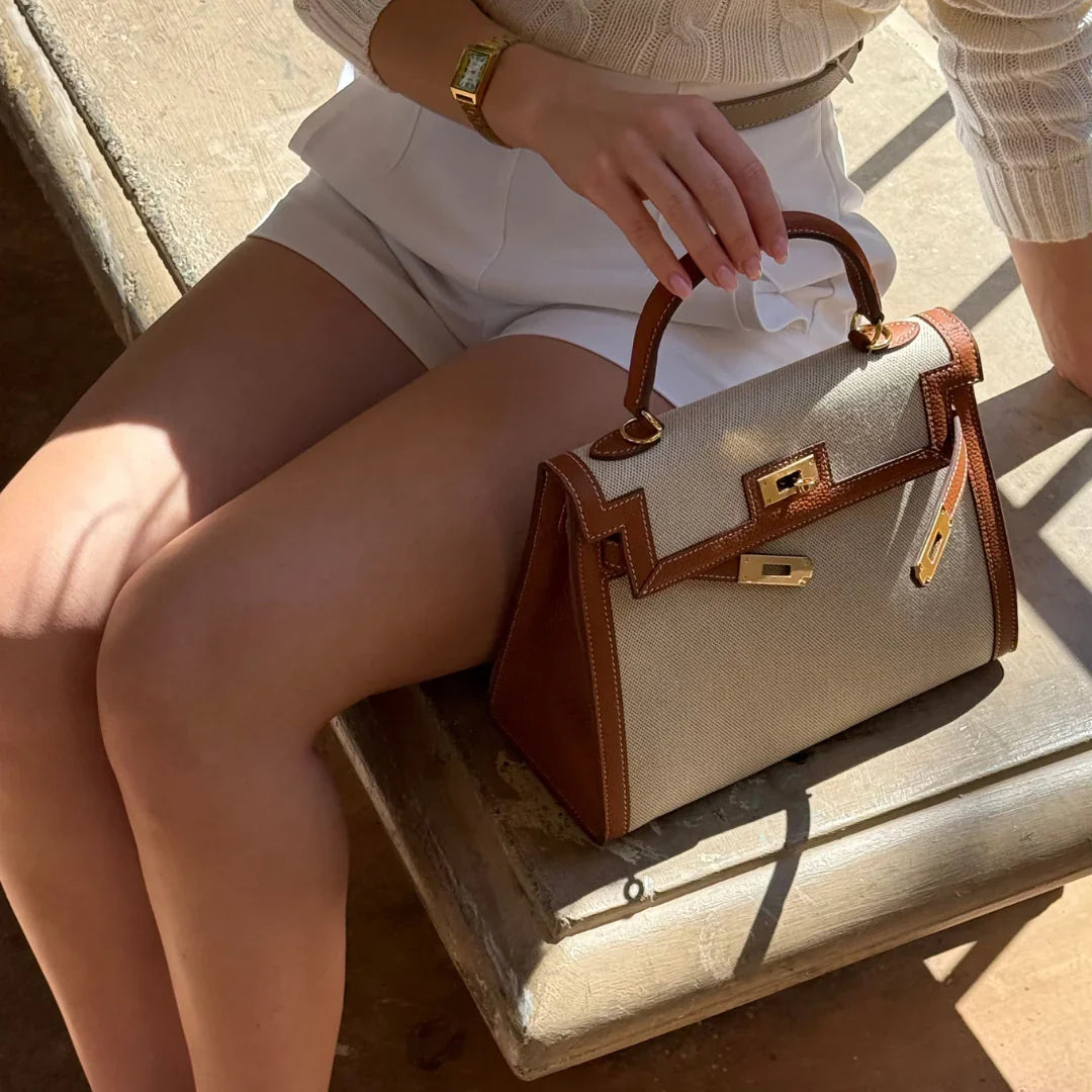 Sola Elegant Handbag with two-tone design and gold-tone hardware. 3