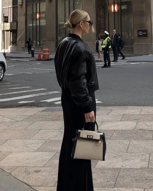 Sola Elegant Handbag with two-tone design and gold-tone hardware. 8