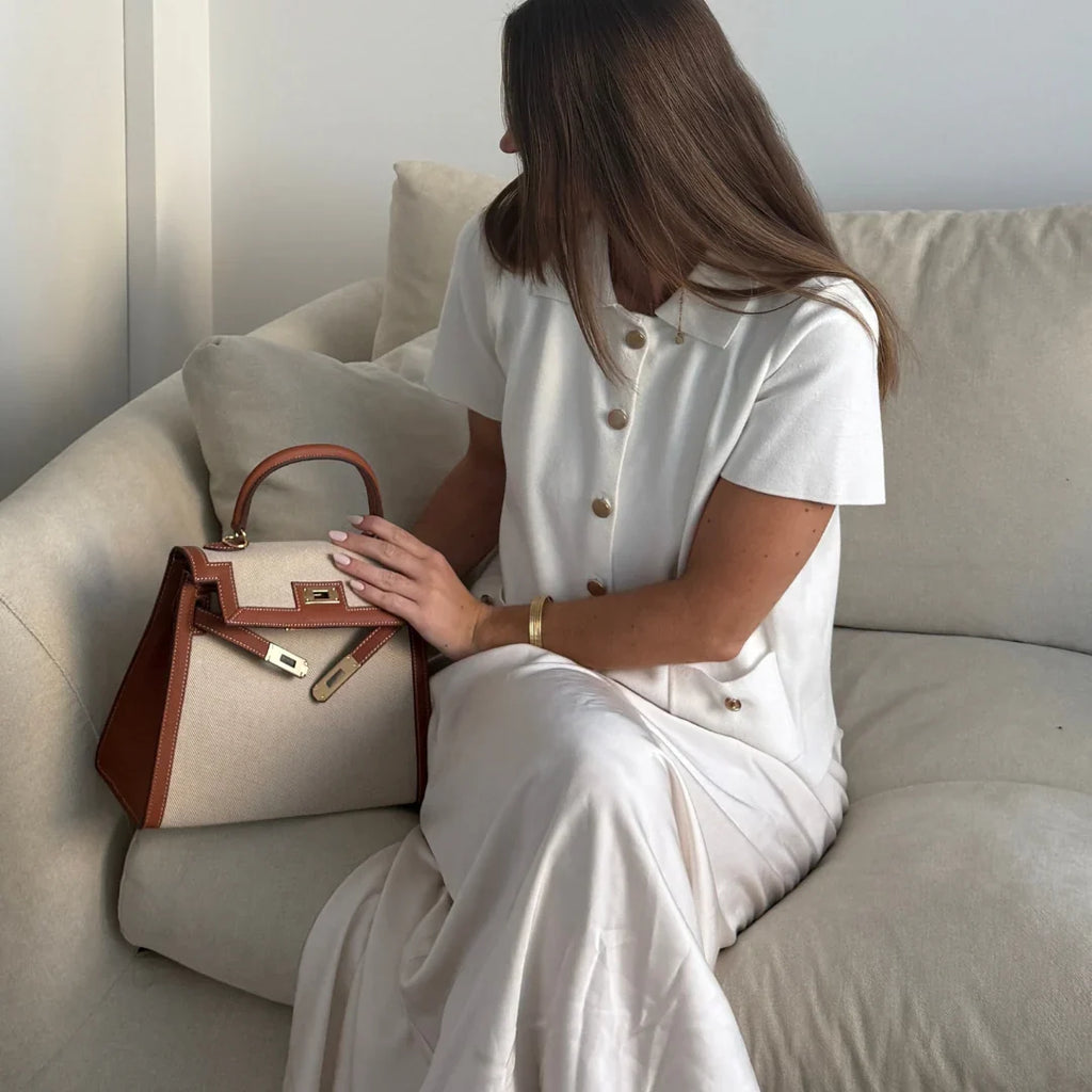 Sola Elegant Handbag with two-tone design and gold-tone hardware. 9