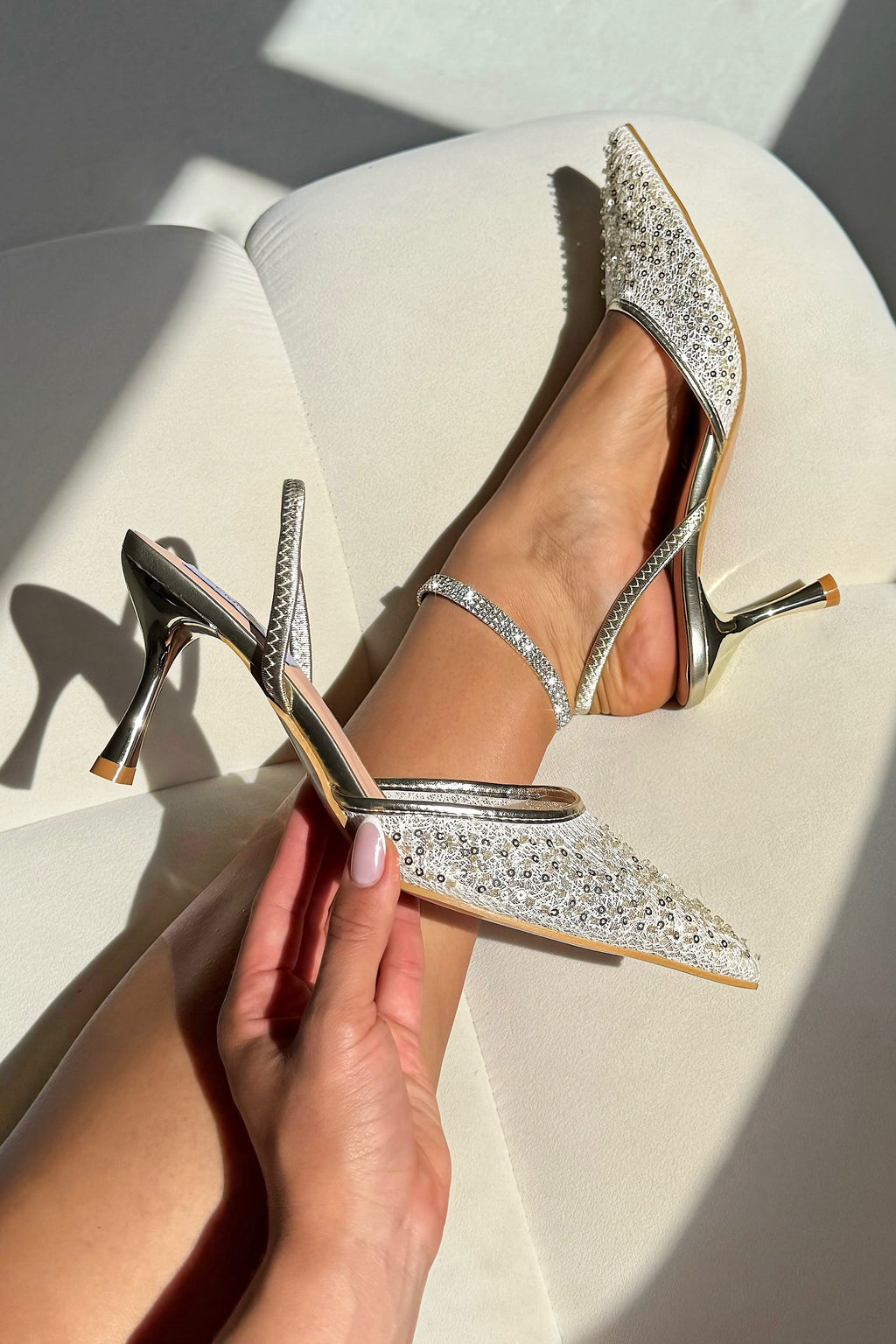 Sparkling heavenly slingback heels in gold for elegant occasions.