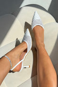 Sparkling heavenly slingback heels in white with glitter embellishments.