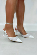 Sparkling heavenly slingback heels in white with glitter embellishments. 3