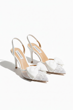 Sparkling transparent muse bow slingback heels in white. 3