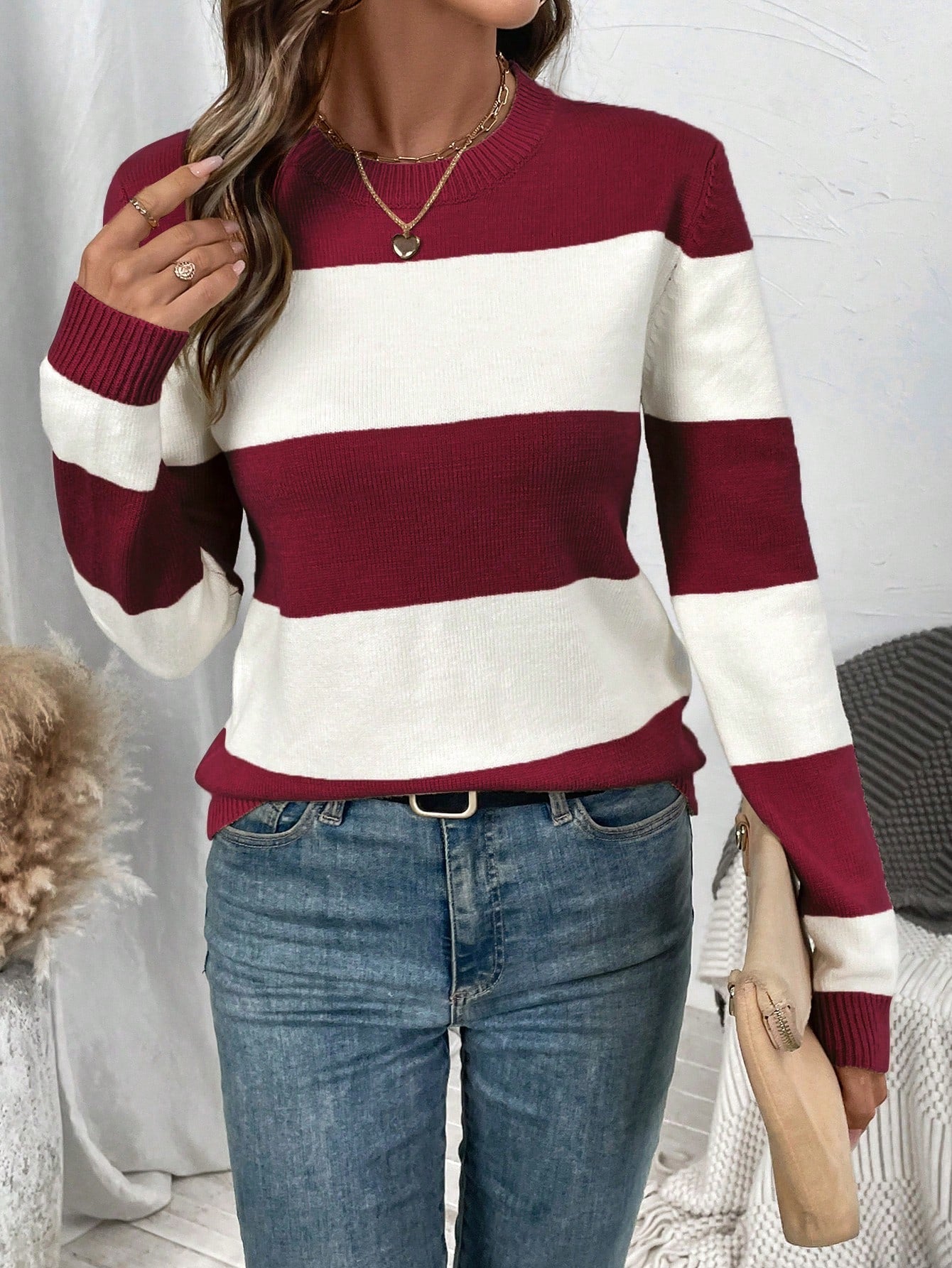 Elegant striped women's sweater with round neckline and long sleeves. 11