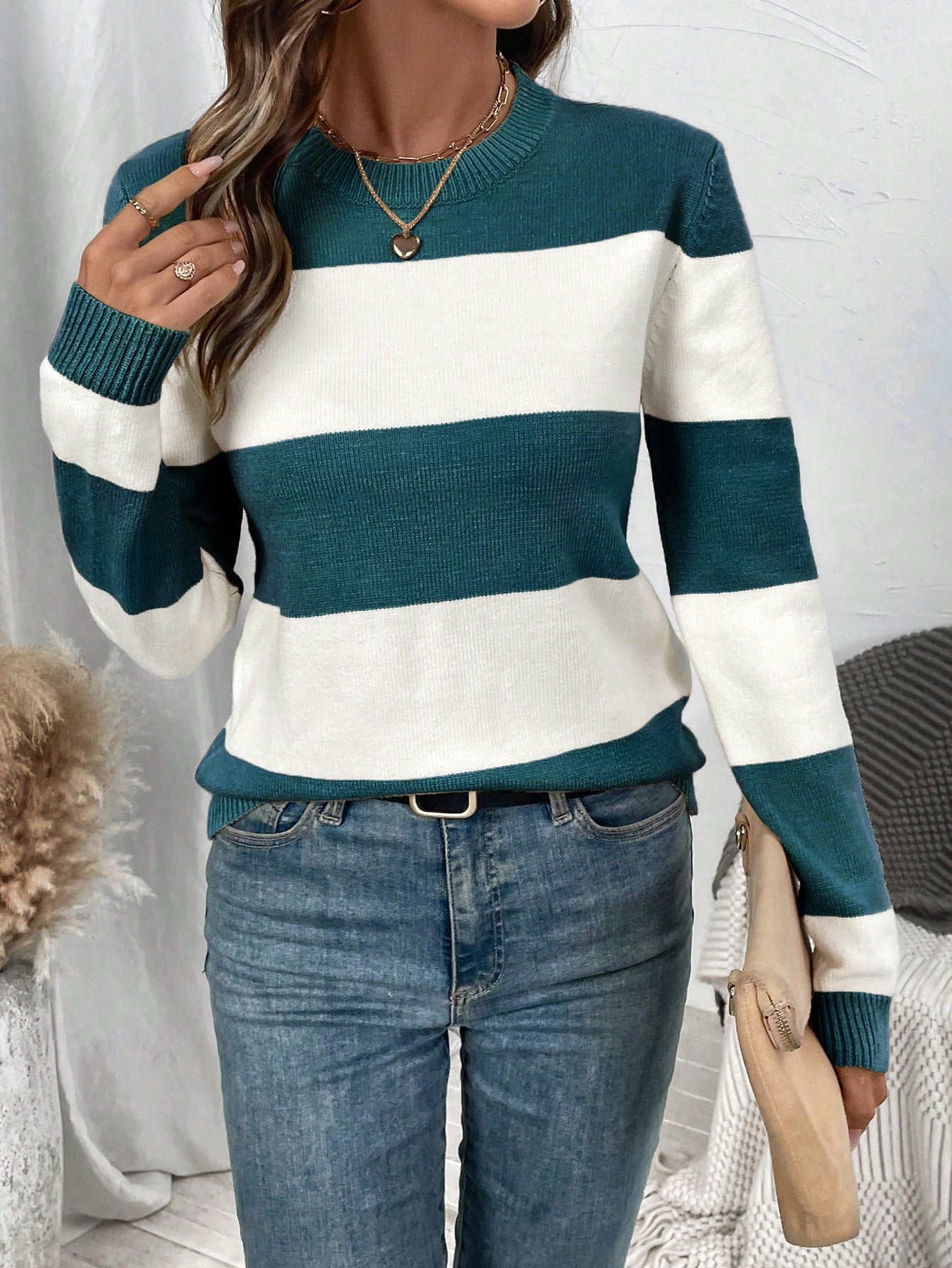 Elegant striped women's sweater with round neckline and long sleeves. 6