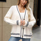 Stylish women's cardigan with cable pattern and contrast stripes. 4