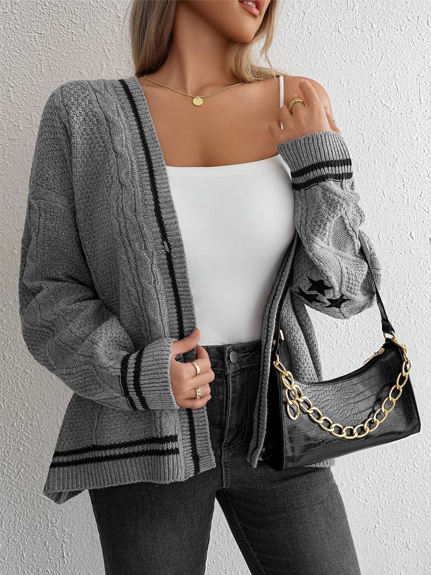 Stylish women's cardigan with cable pattern and contrast stripes. 6