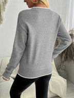 Stylish women's sweater with snowflake pattern, perfect for winter wear. 5