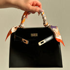 Vanessa Elegant mini handbag in burgundy and black leather. 7