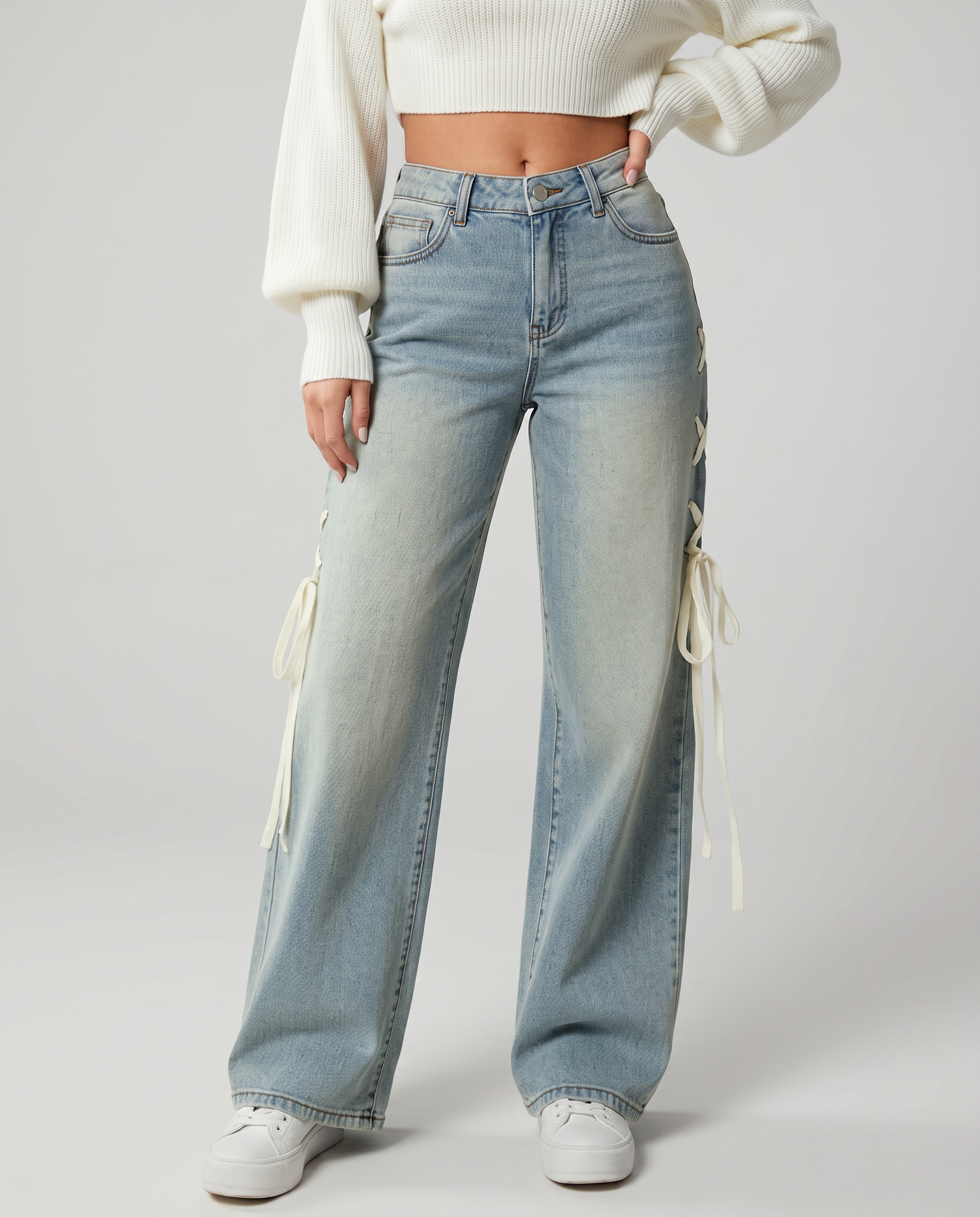 Stylish wide jeans with side laces in light blue denim.